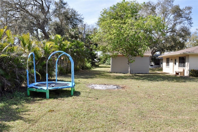 view of yard featuring a trampoline