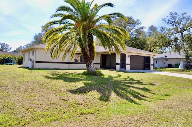 ranch-style home with a garage, concrete driveway, a front lawn, and stucco siding