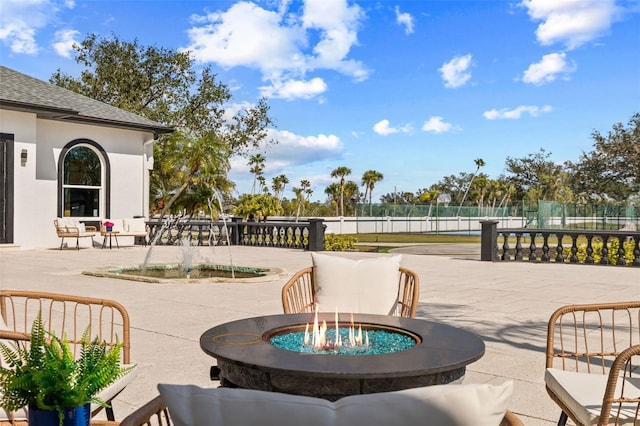 view of patio with a fire pit