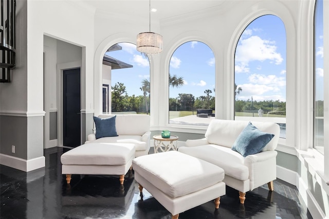 sunroom with a chandelier