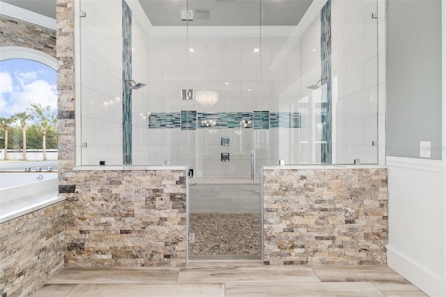 bathroom with shower with separate bathtub