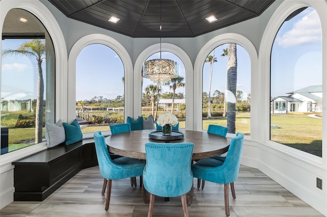 sunroom / solarium with vaulted ceiling