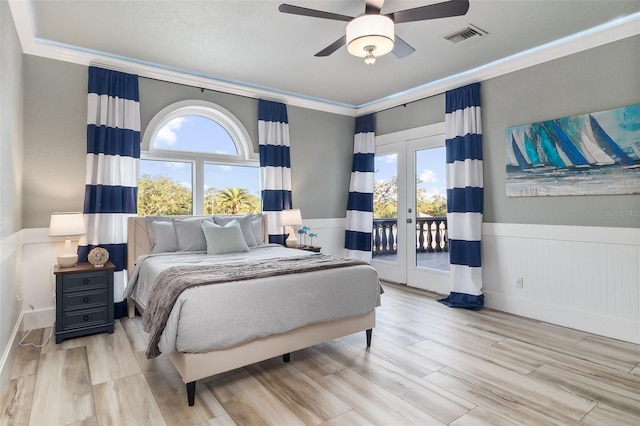 bedroom featuring multiple windows, access to exterior, french doors, and ornamental molding