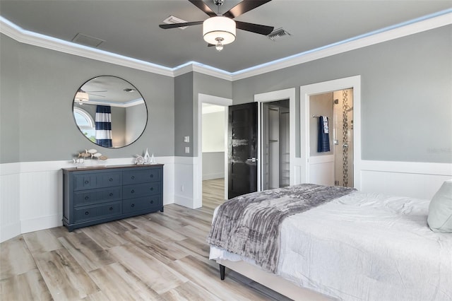 bedroom with ceiling fan, crown molding, and light hardwood / wood-style floors