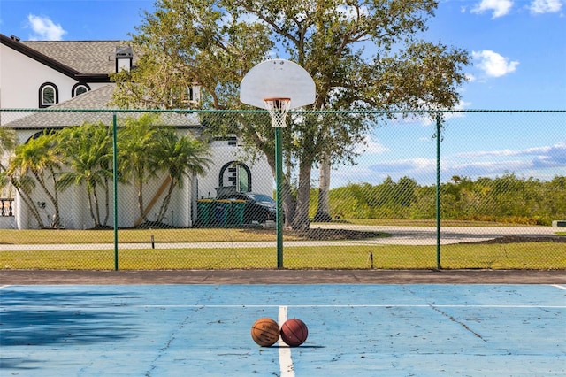 view of basketball court featuring a lawn