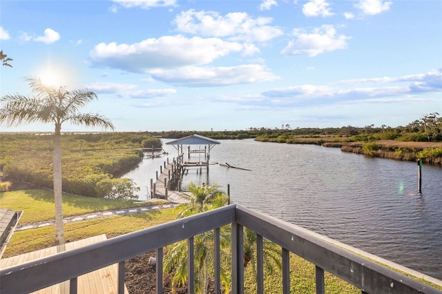 property view of water with a dock