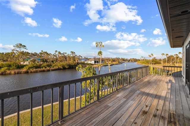 wooden deck featuring a water view