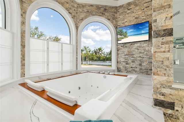 bathroom with tiled bath