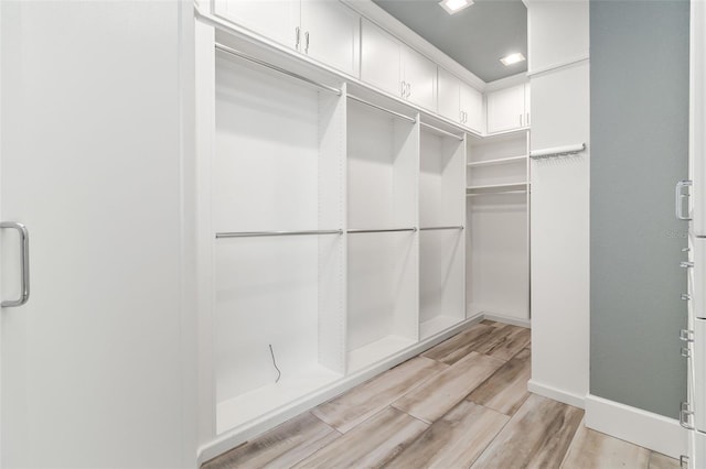 walk in closet featuring light wood-type flooring