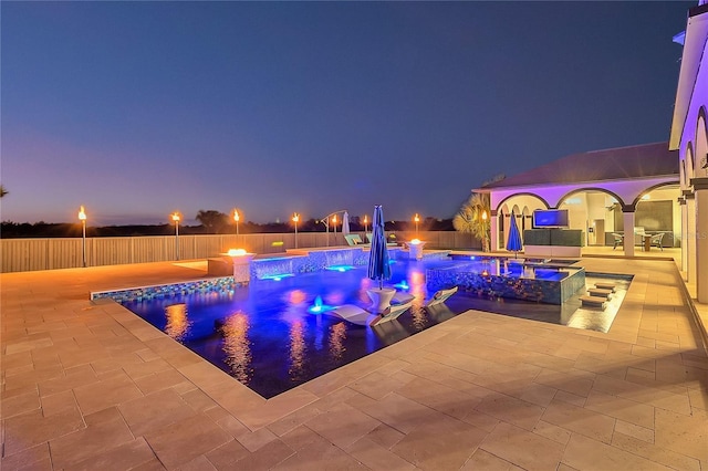 view of pool featuring pool water feature, an in ground hot tub, and a patio area