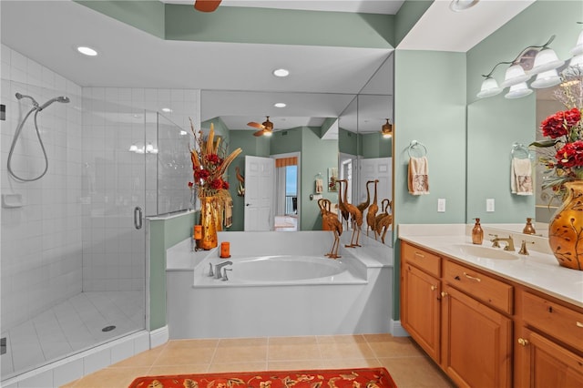 bathroom with ceiling fan, a shower stall, vanity, tile patterned flooring, and a bath