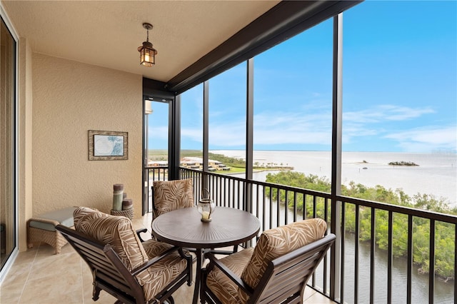 sunroom with a water view