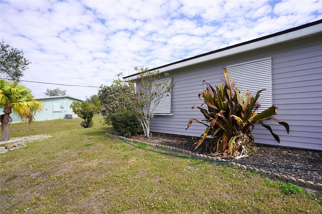 view of property exterior with a lawn