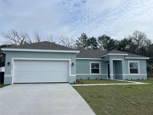 single story home with a front lawn and a garage