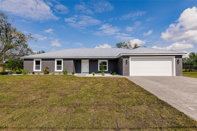 ranch-style home featuring a garage and a front lawn