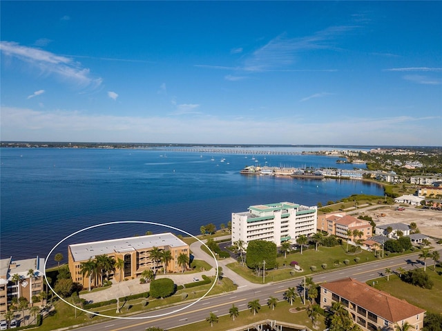 birds eye view of property with a water view