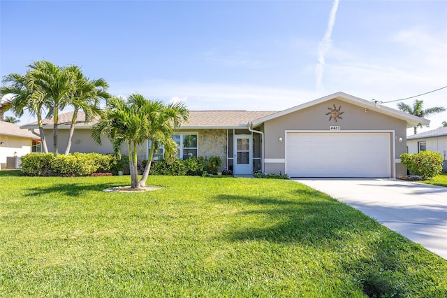 ranch-style house featuring a garage, central AC, and a front lawn