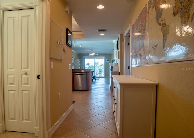 hallway with light tile patterned floors