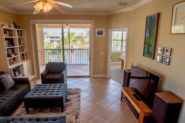 tiled living room featuring crown molding and ceiling fan