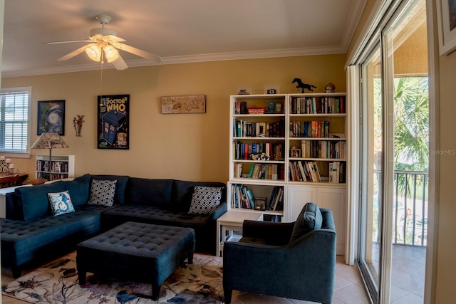 living room featuring ornamental molding, a healthy amount of sunlight, light tile patterned floors, and ceiling fan
