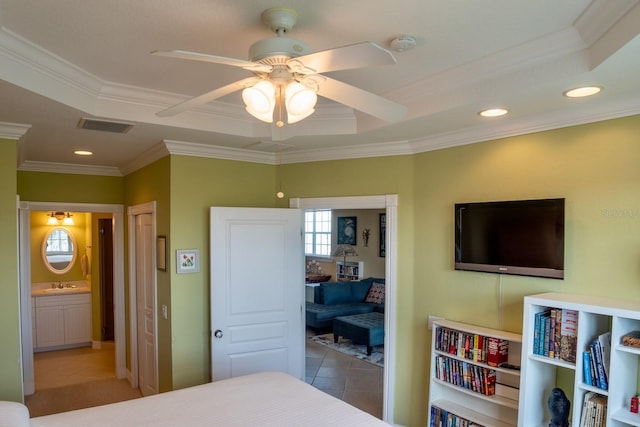 tiled bedroom with crown molding, ceiling fan, connected bathroom, and sink