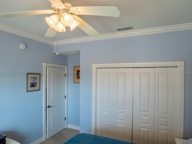 unfurnished bedroom with carpet floors, ornamental molding, a closet, and ceiling fan