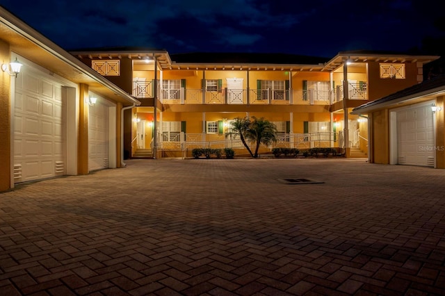exterior space with a balcony and a garage