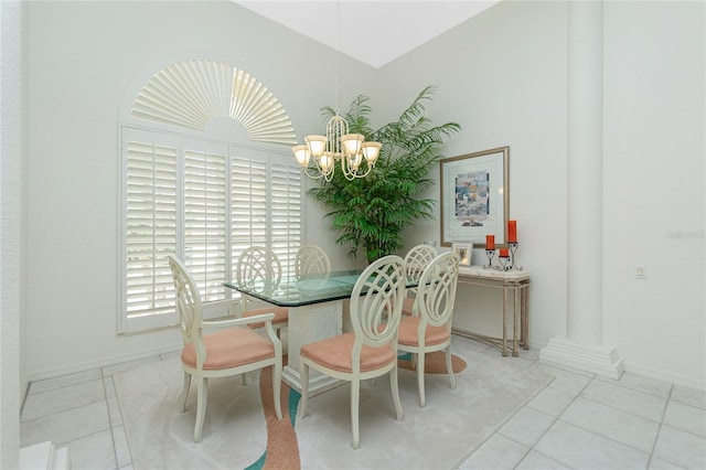 tiled dining space with an inviting chandelier