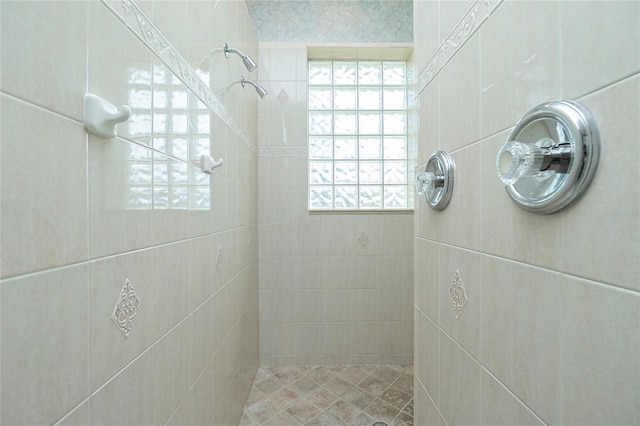 bathroom with tiled shower