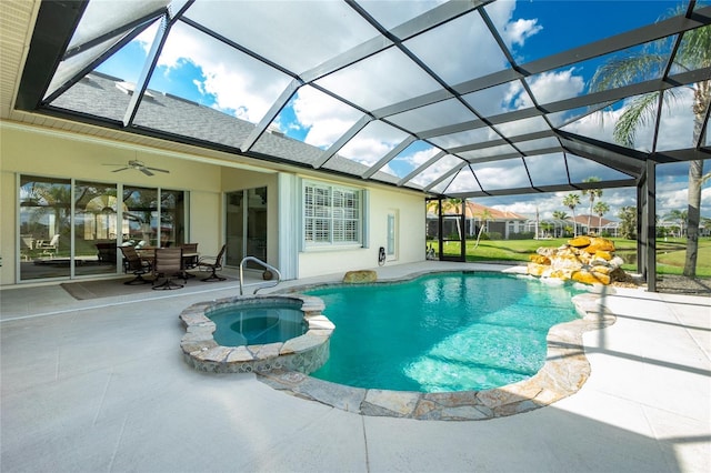 view of pool featuring an in ground hot tub, ceiling fan, a lanai, and a patio