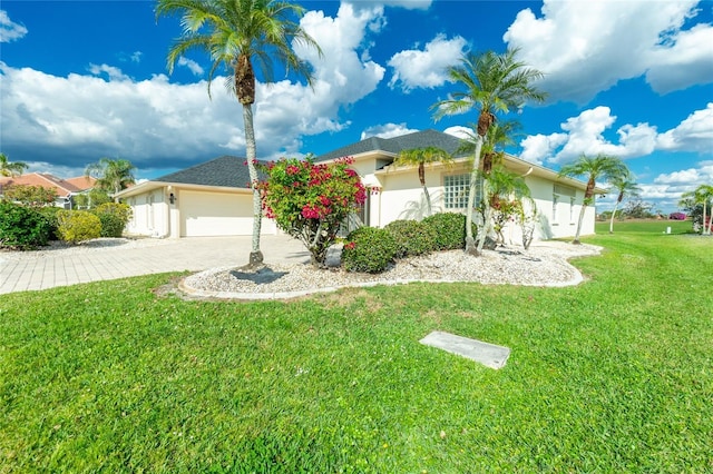 view of front of house featuring a garage and a front yard