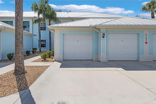 garage featuring driveway