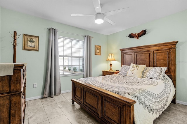 bedroom featuring light tile patterned flooring, ceiling fan, and baseboards