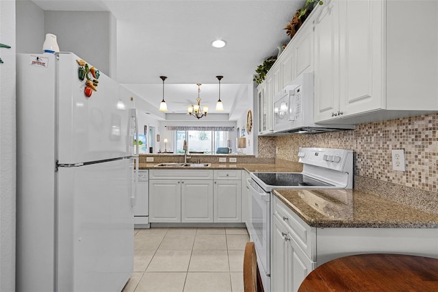 kitchen featuring a sink, backsplash, white appliances, white cabinets, and light tile patterned floors