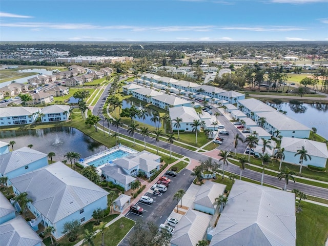 aerial view featuring a residential view and a water view