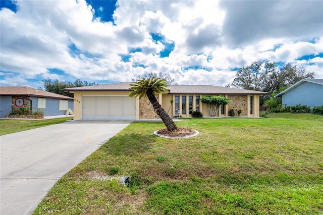 view of front of property featuring a front lawn, concrete driveway, stucco siding, stone siding, and an attached garage