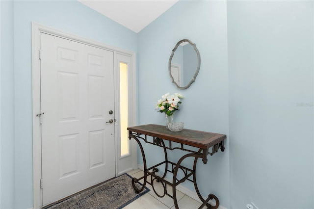 entryway with light tile patterned floors