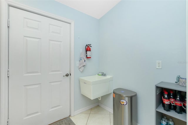 bathroom featuring sink and tile patterned flooring