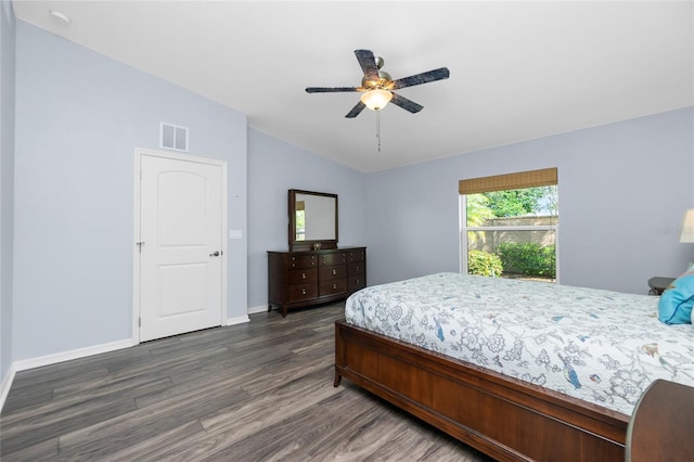 bedroom featuring vaulted ceiling, dark hardwood / wood-style floors, and ceiling fan