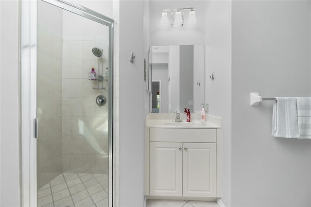 bathroom with an enclosed shower and vanity