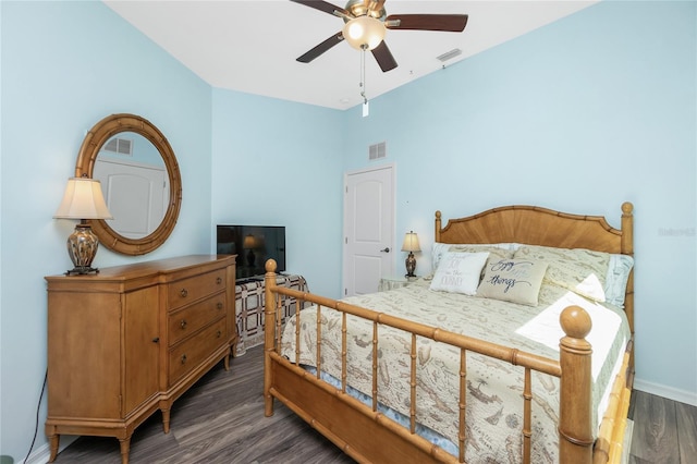 bedroom featuring dark wood-type flooring, lofted ceiling, and ceiling fan