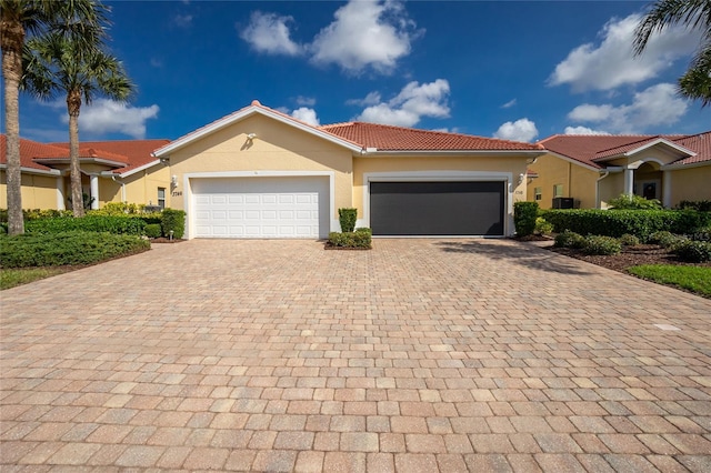 view of front of property with a garage