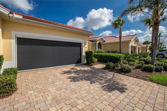 mediterranean / spanish-style house featuring a garage