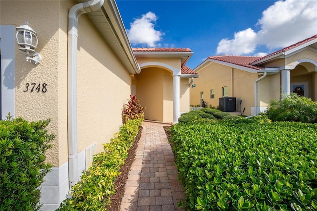 property entrance with central AC unit