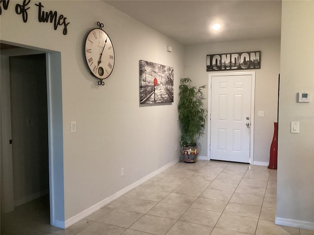 entryway with light tile patterned floors