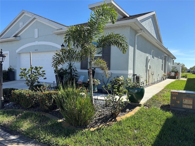 24313 Westgate Blvd, Punta Gorda, FL 33980 - view of property exterior featuring stucco siding and an attached garage