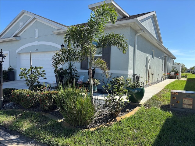 view of property exterior with a garage and stucco siding