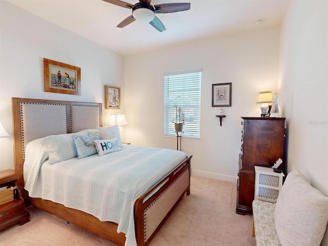 24313 Westgate Blvd, Punta Gorda, FL 33980 - bedroom featuring light colored carpet, baseboards, and a ceiling fan
