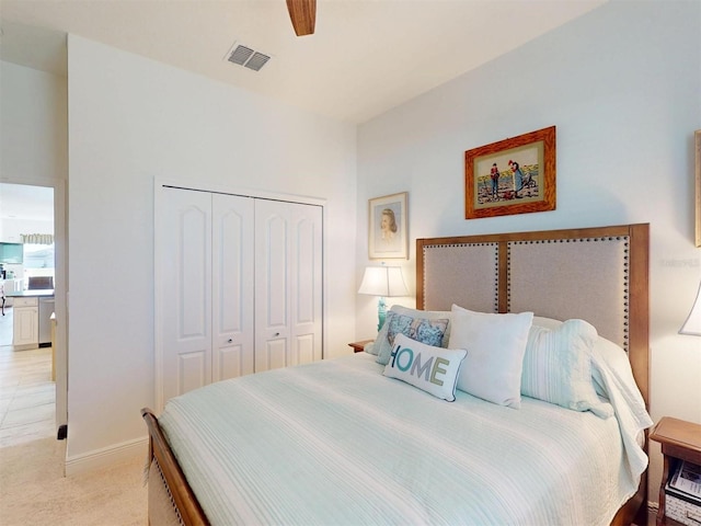 24313 Westgate Blvd, Punta Gorda, FL 33980 - bedroom featuring a closet, light carpet, ceiling fan, and baseboards
