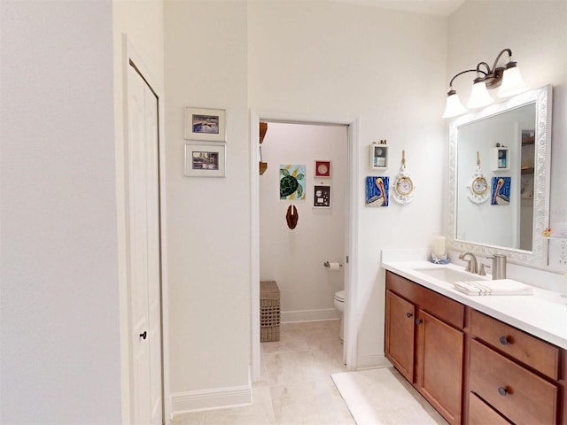 24313 Westgate Blvd, Punta Gorda, FL 33980 - bathroom with vanity, toilet, baseboards, and a closet